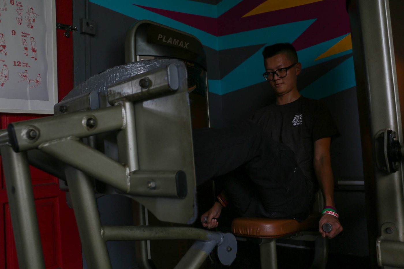 Member on the leg extension machine at Blitz Gym SS15